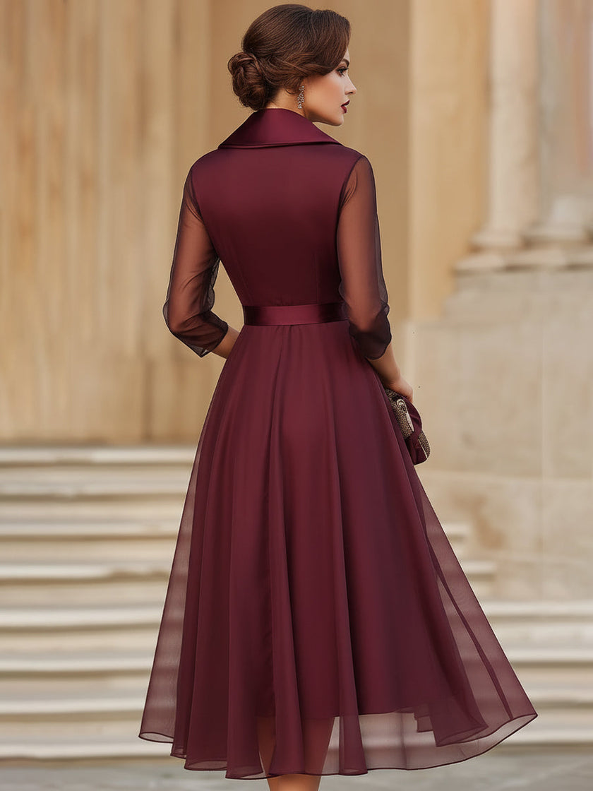 FJØRNA elegant wrap midi dress for women with sheer sleeves, showcasing a sophisticated, flowing design for stylish occasions.
