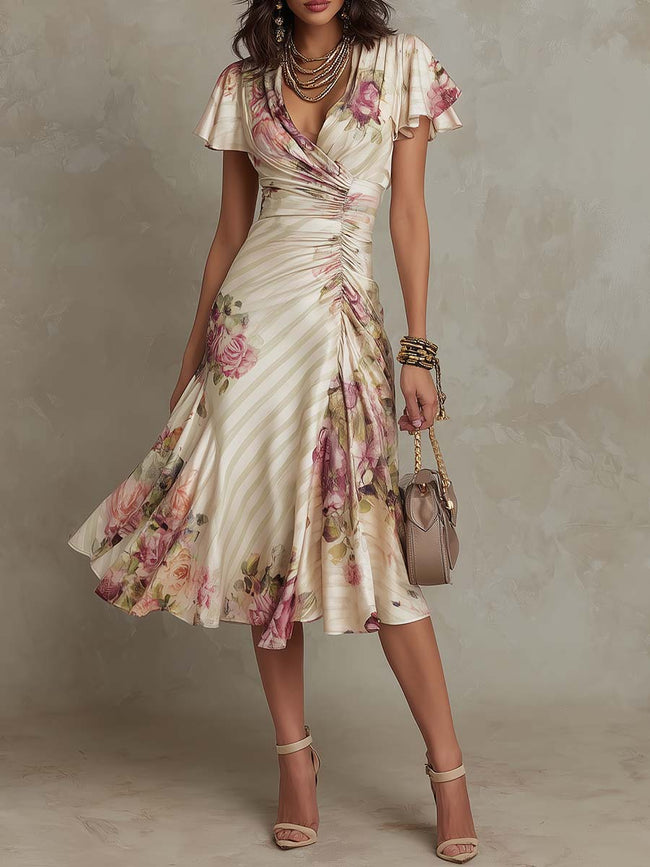 FJØRNA chiffon floral midi dress with flowy fabric and elegant design, perfect for evening occasions.