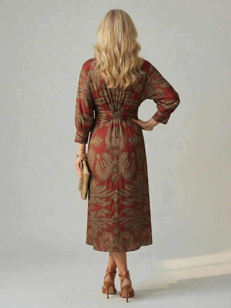FJØRNA women's summer midi dress with long sleeves and wrap style, featuring a flowing fabric and elegant design.