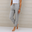 FJØRNA Lori™ premium breathable pants with elastic waistband, soft fabric and comfortable fit, shown in a relaxed pose.