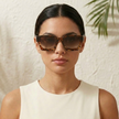Vintage rectangular unisex sunglasses by FJØRNA with dark tinted lenses and sleek black frames, accessory for women.