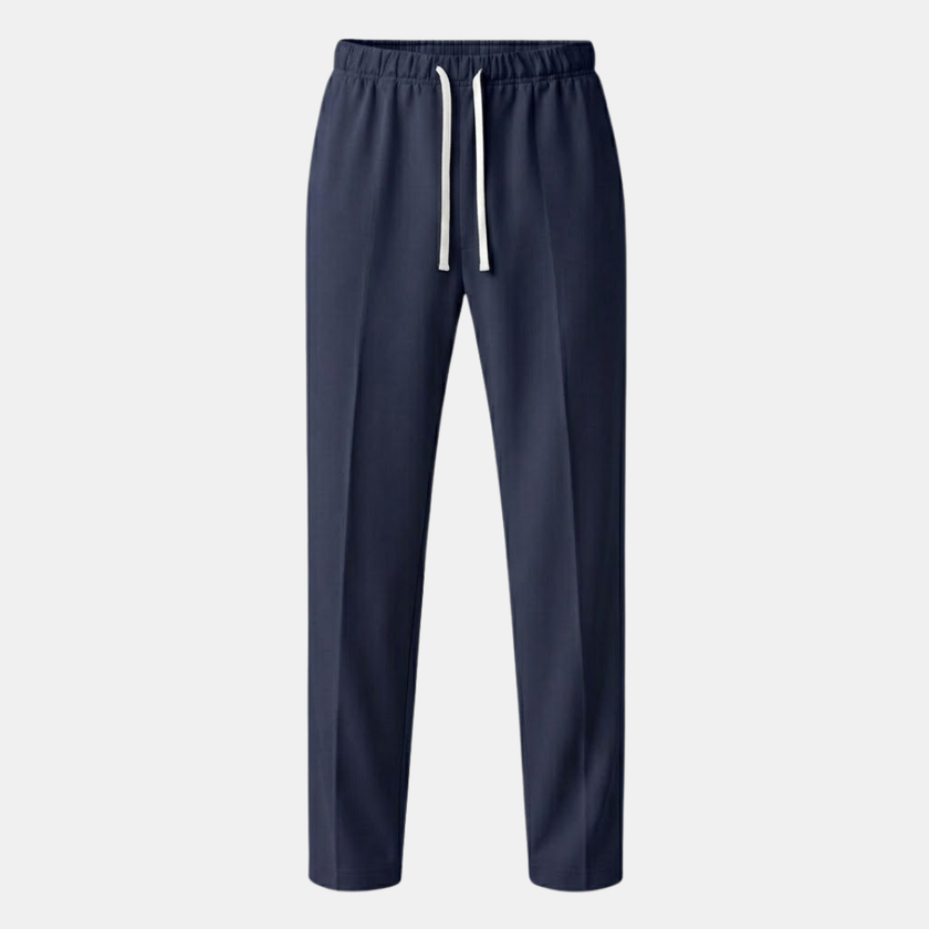 FJØRNA men's wide leg joggers with drawstring waist, featuring a relaxed fit and soft fabric, shown on a model.