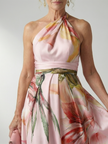 FJØRNA summer maxi dress for women featuring a floral pattern, halter neck, sleeveless design, and relaxed fit.