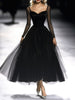 FJØRNA black maxi dress for women, flowing sleeveless dress with a fitted waist, perfect for elegant occasions.