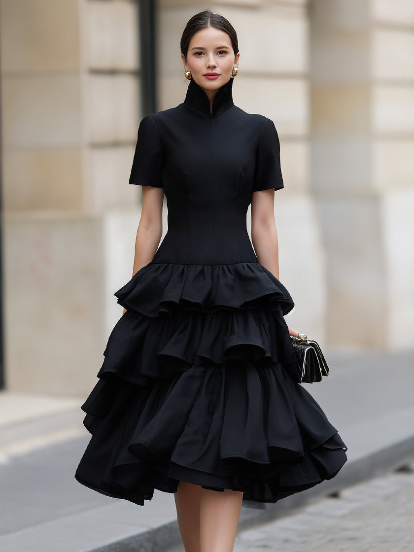 FJØRNA high neck tiered ruffle midi dress featuring a flowy silhouette and layered ruffles, perfect for elegant occasions.