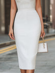 White sheer halter neck midi sheath dress by FJØRNA, featuring a fitted silhouette and elegant design, shown on a dress form.
