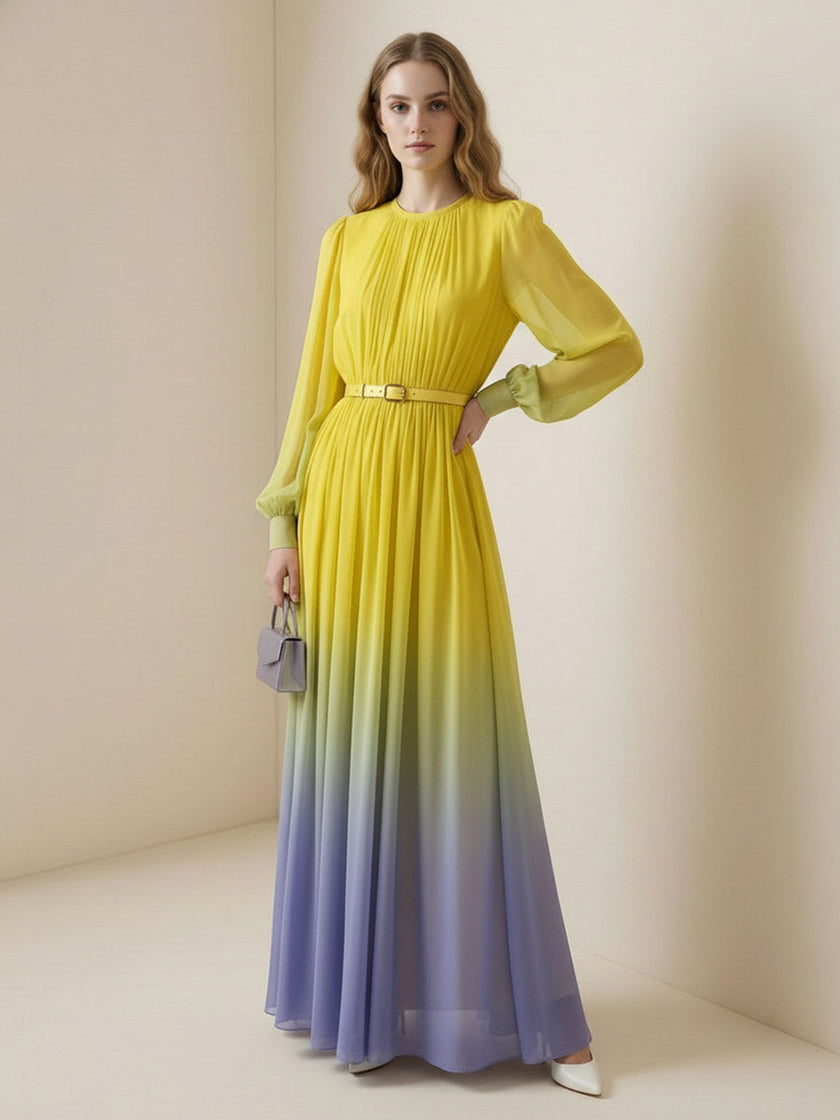 FJØRNA high waisted maxi dress with long sleeves, belt, contrast color gradient, pleated details, and round neck.