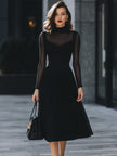 FJØRNA sheer-sleeve high-neck A-line midi dress for women, elegant midi dress with delicate sheer sleeves and a fitted high neckline.