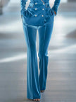 Blue loose velvet flared trousers for women by FJØRNA, featuring a relaxed fit and wide-leg style.