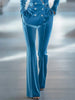 Blue loose velvet flared trousers for women by FJØRNA, featuring a relaxed fit and wide-leg style.