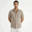 Men's cotton-linen short sleeve shirt by FJØRNA, shown in a relaxed fit with a classic collar and natural fabric texture.