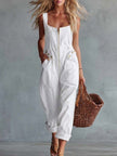 Light yellow denim jumpsuit with square neckline and zip-front closure, by FJØRNA, shown on model.