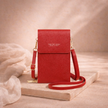 FJØRNA women's crossbody bag with adjustable strap, made of stylish leather, featuring a compact design and multiple compartments.