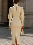 White FJØRNA cream turtleneck puff-sleeve fitted midi dress, bodycon style, shown on a model with a sleek silhouette.