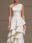 Ivory FJØRNA one-shoulder tiered ruffle gown, white maxi dress for women, featuring flowing fabric and elegant design.