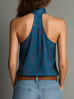 FJØRNA teal floral print satin high-neck blouse featuring a stylish high neckline and elegant floral pattern.