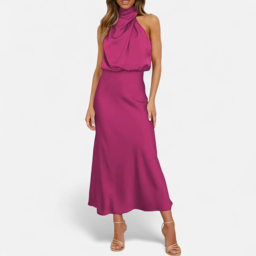 FJØRNA draped sleeveless halter maxi dress in flowy fabric, featuring a fitted waist and elegant draping.