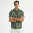 Men's cotton-linen short sleeve shirt by FJØRNA, shown in a relaxed fit with a button-up front and casual collar.