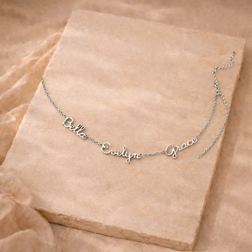 Unisex personalized jewelry necklace by FJØRNA with engraved pendant, showcasing elegant design and custom details.