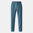 Men's wide leg joggers by FJØRNA with drawstring waist, comfortable casual pants shown in a relaxed fit style.