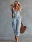 Light yellow denim jumpsuit with square neckline and zip-front closure by FJØRNA, showing the fitted style and casual design.