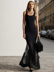 Black sheer mesh mermaid maxi dress by FJØRNA featuring fitted silhouette and elegant flowing fabric.