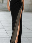 FJØRNA high-neck metallic thread knit slit maxi dress displayed on a model, showcasing its elegant design and shiny fabric.