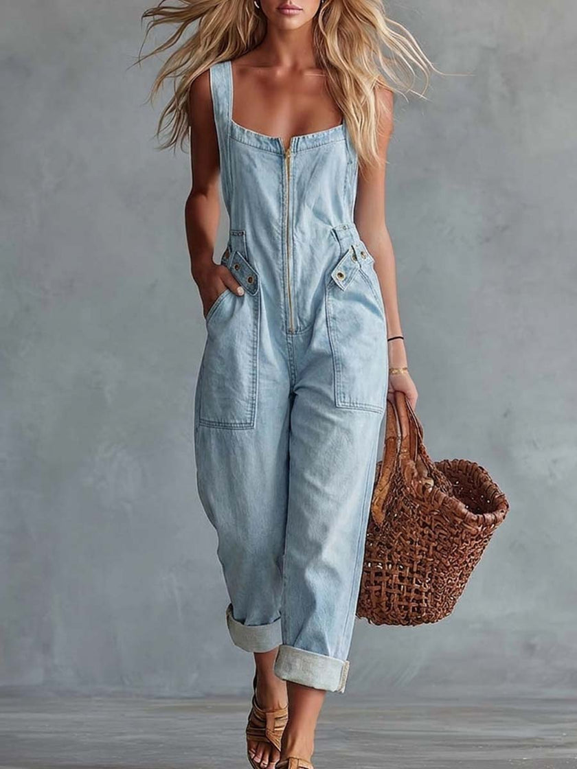Light yellow denim jumpsuit with square neckline and zip front by FJØRNA, shown on a model.