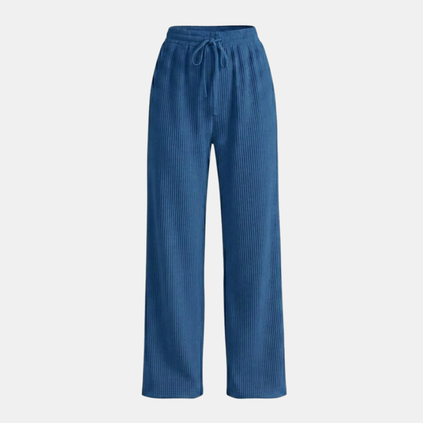 FJØRNA women's wide leg trousers with elastic waist and pleated design, featuring a relaxed fit and flowing fabric.