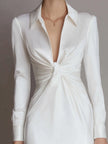 FJØRNA white long-sleeve twist-front shirt dress for women, featuring a fitted waist and classic collar, front twist detail.