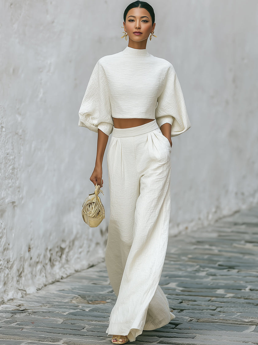Cream textured lantern sleeve two-piece pants set from FJØRNA featuring stylish lantern sleeves and comfortable fit.
