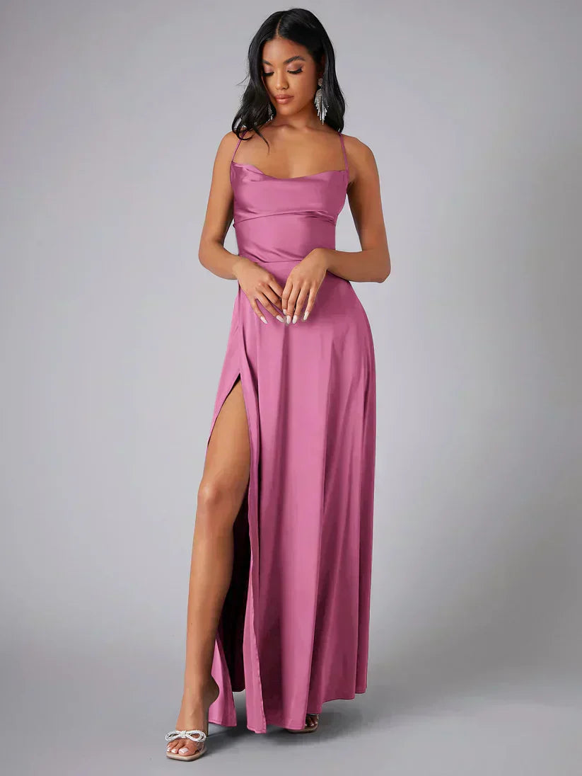 FJØRNA white maxi dress with spaghetti straps, flowing fabric, perfect for evening or summer occasions.