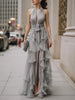 FJØRNA halter neck draped ruffle maxi dress featuring flowing fabric and elegant design, perfect for formal occasions.