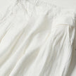 FJØRNA lightweight summer women's trousers with high waist, wide leg design, and side pockets, suitable for warm weather.