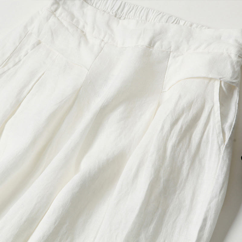 FJØRNA lightweight summer women's trousers with high waist, wide leg design, and side pockets, suitable for warm weather.