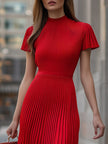 FJØRNA elegant red pleated midi dress with flowing fabric and waistline detail, perfect for formal occasions