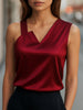 FJØRNA women's burgundy satin sleeveless blouse with asymmetric neckline, stylish top for women, elegant and modern design.