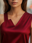 FJØRNA burgundy satin blouse for women, sleeveless top with asymmetric neckline, elegant satin finish and stylish design