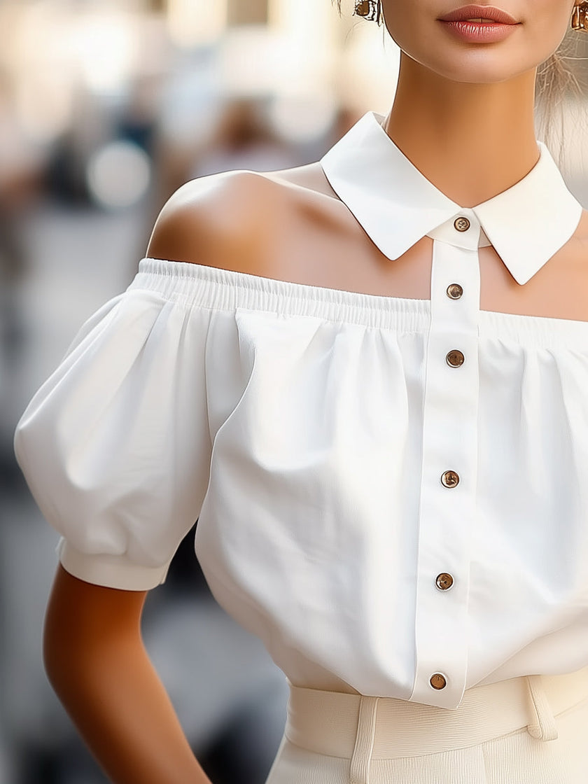 White FJØRNA women's off-shoulder blouse with puff sleeves, button-up front, and statement collar, stylish and elegant top for women.