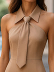 FJØRNA urban halter-neck pencil dress with statement tie, mini dress for women, close-up showing stylish design and fit.