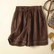 FJØRNA Rica™ relaxed floral shorts with a lightweight fabric, featuring a vibrant floral pattern and adjustable waist.