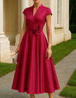 Red satin midi dress for women with V-neck and A-line floral design by FJØRNA, shown on a model.