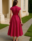 Red satin midi dress for women by FJØRNA featuring a V-neck, A-line silhouette, and floral pattern.