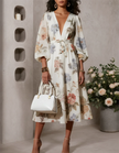 Ivory chiffon midi dress for women with V-neck and printed design, by FJØRNA, flowing fabric and elegant style.