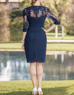 Navy blue tulle midi dress for women by FJØRNA, featuring pleated design and two-piece set style, displayed on a model.
