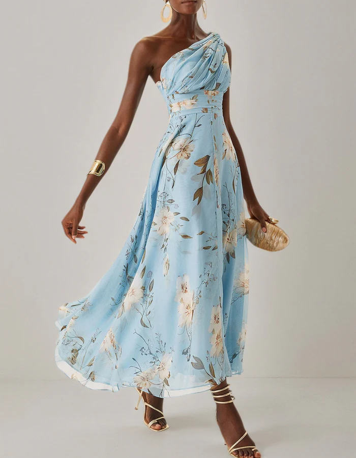 Light blue chiffon midi dress for women by FJØRNA, featuring a one-shoulder design and floral pattern.