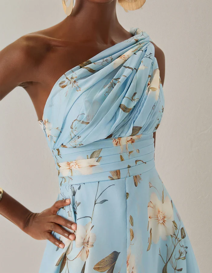 Light blue chiffon midi dress for women by FJØRNA featuring a one-shoulder design and floral pattern.