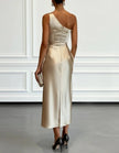 FJØRNA champagne satin midi dress for women with one-shoulder design and pleated details, elegant evening wear.