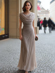 FJØRNA draped cowl-neck ruched maxi dress displayed on a hanger, showcasing its elegant fabric and flowing silhouette.