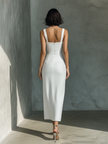 White cotton and linen blend sleeveless women's midi dress by FJØRNA, showcasing a flowy, lightweight summer dress.